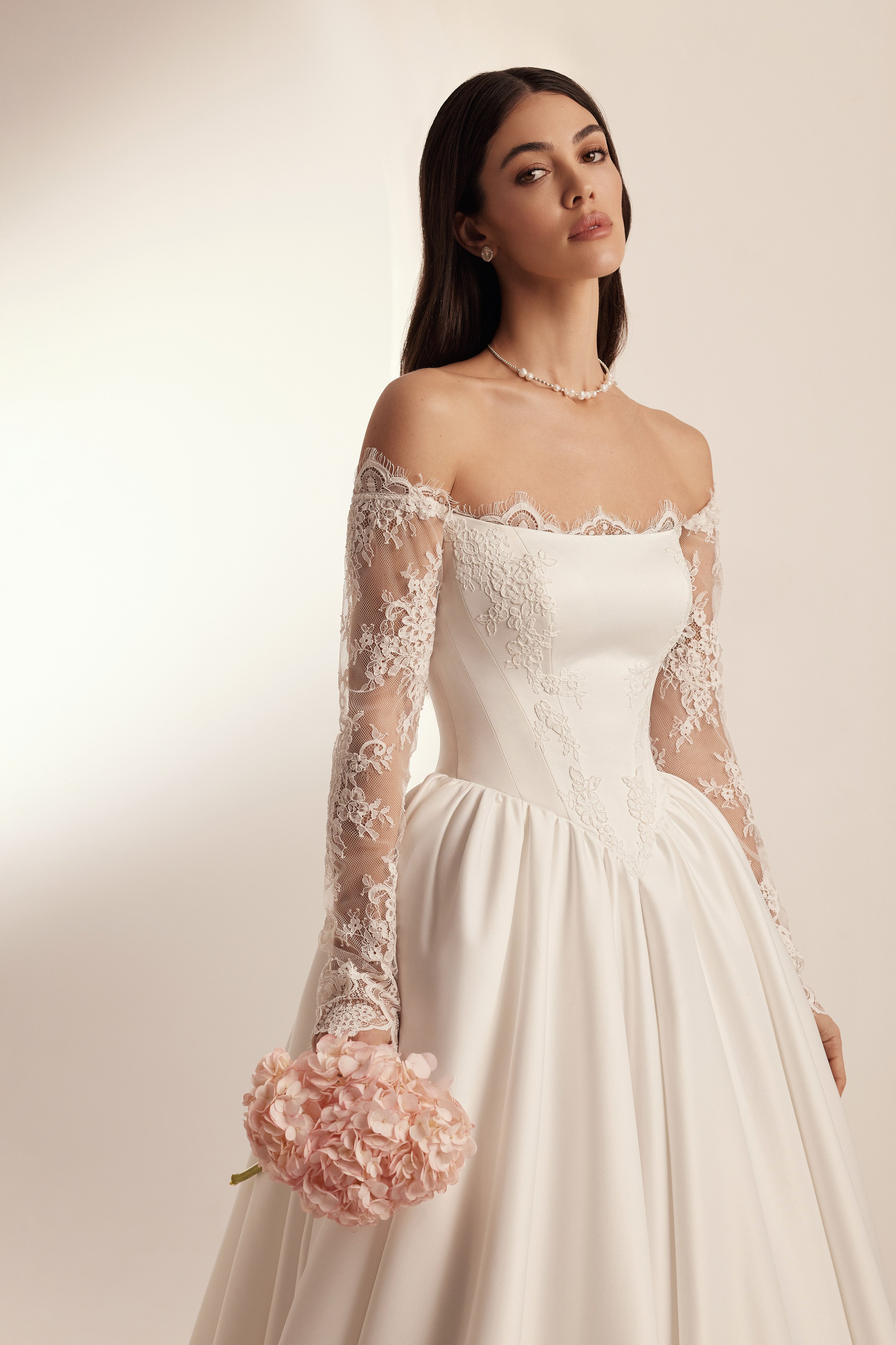 A-line wedding dress with basque waist in satin with lace sleeves