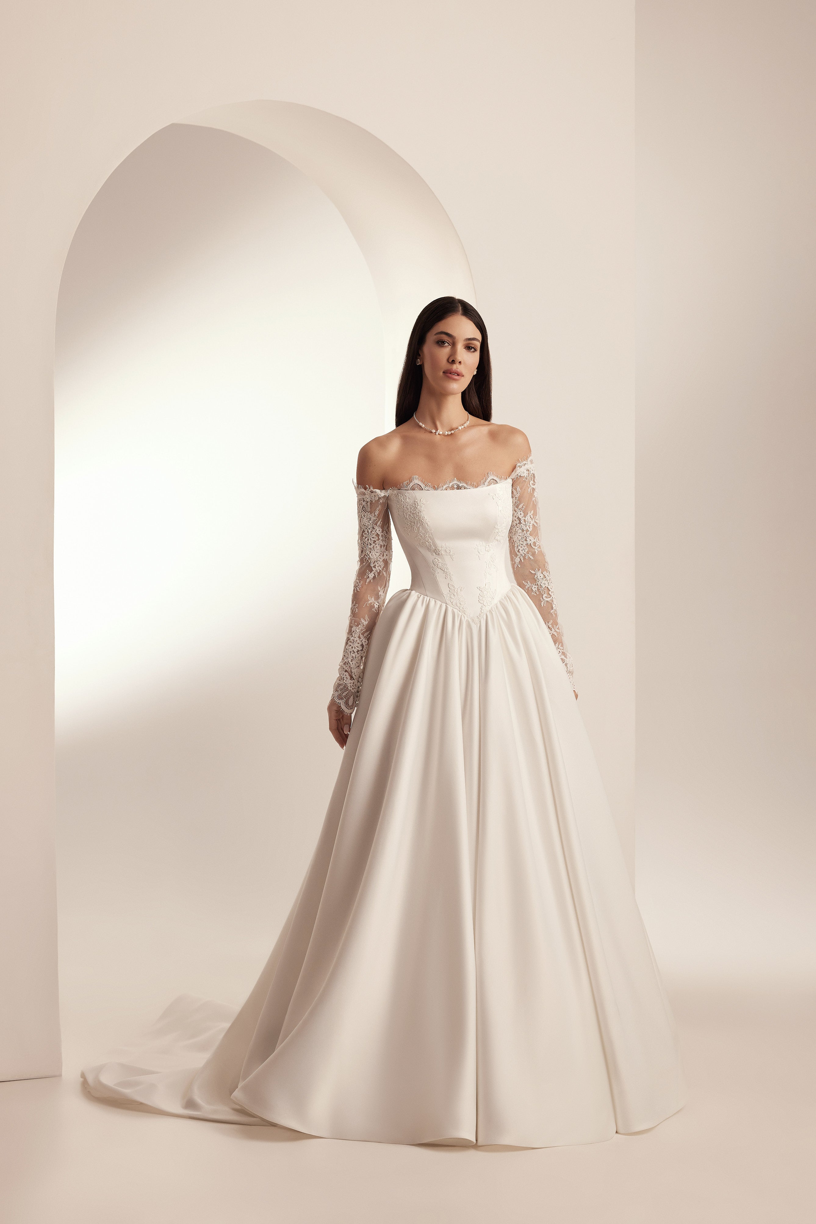 Elegant satin A-line wedding dress with lace details and basque waist